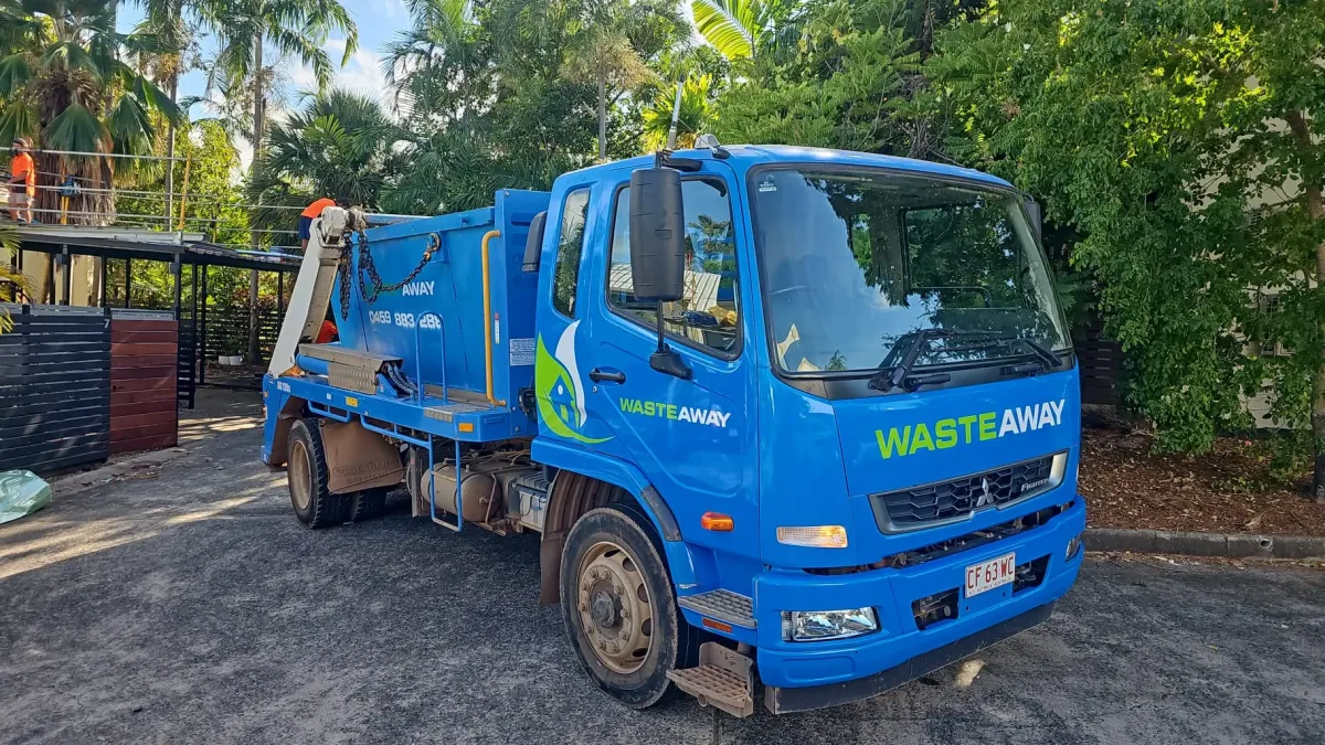 Blue NT Waste Away Mitsubishi Fuso skip truck on a local job